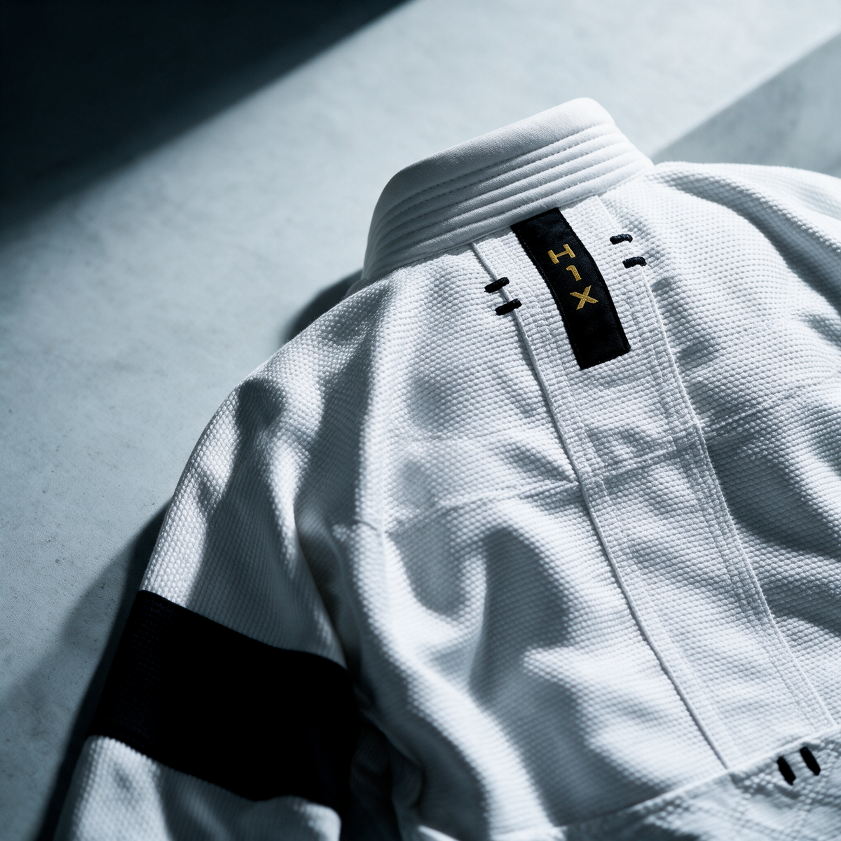 White H1X gi with embroidered Jiujiteiro detail